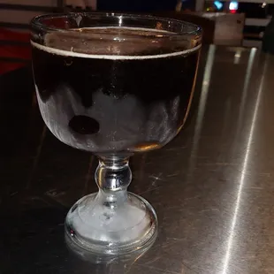 a glass of beer on a table