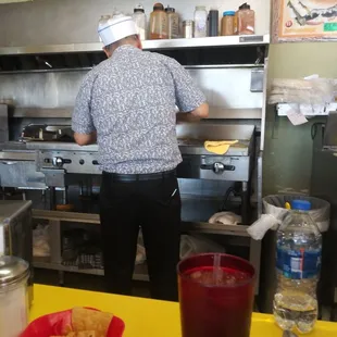 Man cooking our breakfast!