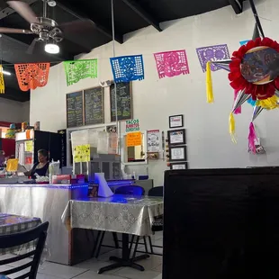 a mexican restaurant with tables and chairs