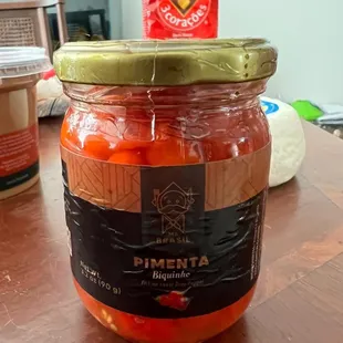 a jar of pickled tomatoes