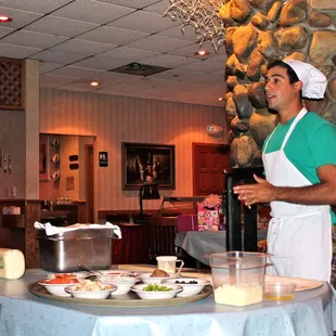 Teaching the kids how to make a pizza