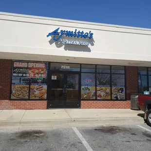 a truck parked in front of a restaurant