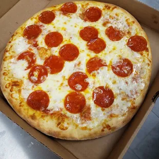 a pepperoni pizza in a box