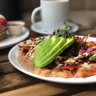 a plate of food and a cup of coffee