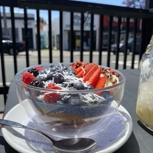 a bowl of fruit and yogurt on a table