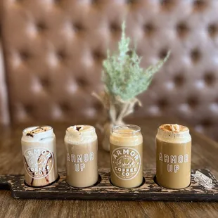 three coffee drinks on a tray