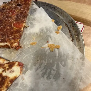 Pizza on a dirty tray