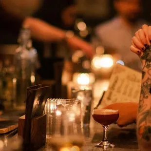 a woman sitting at a bar
