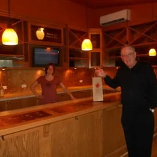 a man and woman in a wine cellar
