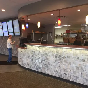 a man standing in front of a counter
