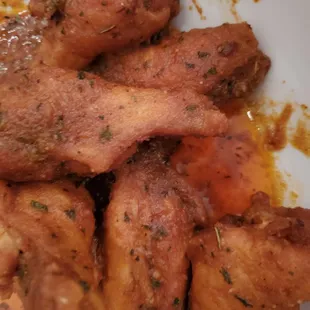 Cajun chicken wings with ranch sauce on the side