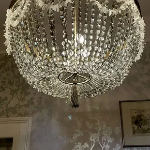 The magnificent, antique chandelier in the "Sins" private dining room.