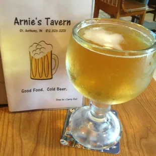 a glass of beer on a table