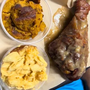 Turkey leg with mac and cheese and sweet potato soufflé
