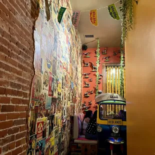 Walkway to bathroom and back seating in a traditional Thai tuktuk