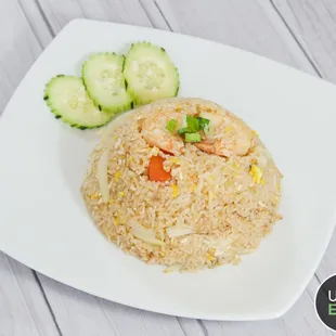 a plate of rice and cucumbers