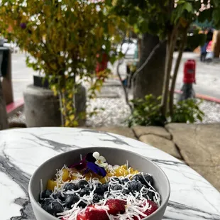 a bowl of fruit and cheese