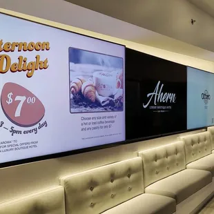 Happy Hour advertisement in the L2 Skybridge connecting the parking garage to the hotel