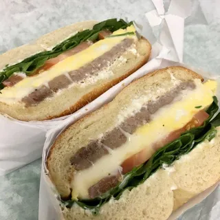 Breakfast Bagel with Sausage, Egg, Spinach, Tomato, and Cheese