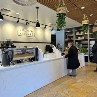 a woman serving a customer at the counter