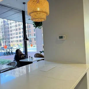 a woman sitting at the counter