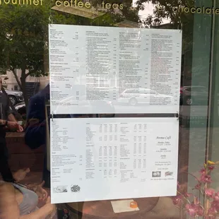 a menu in a window of a coffee shop