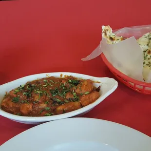 Basmati rice, chicken vindaloo, and garlic naan