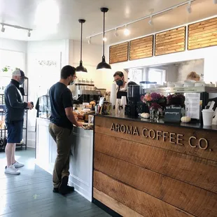 Coffee bar + drink menu (above) + pastry case