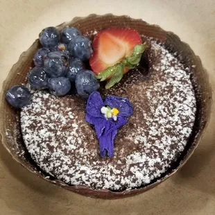Flourless chocolate cake. Flower here looks a little sad, but cake tastes good.