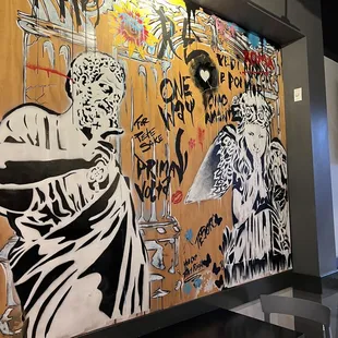 a mural of a woman and a zebra
