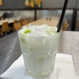 a drink with ice and lime