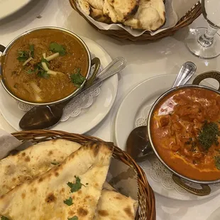 166. Lamb Sahi Korma Specialty (left) , 157. Butter Chicken Makhani Specialty (right), butter naan (upper) , garlic ( lower)