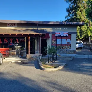 Outside of the restaurant. Aroma House is on the corner.