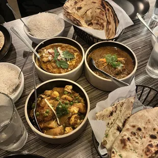 B9. Butter Chicken with Goat Cheese, C20. Aloo Gobi Adraki, B12. Korma, D15. Garlic Naan, D14. Lachha Paratha