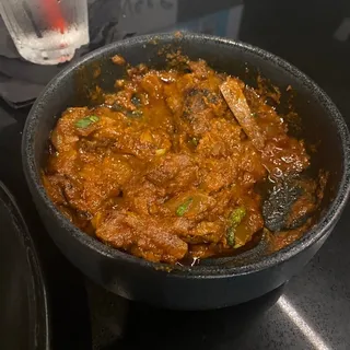 B6. Bhuna Ghee Bone-In Goat