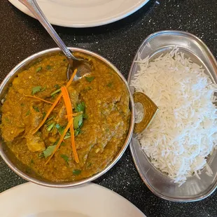 a bowl of curry and a plate of rice
