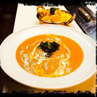 a bowl of soup and a bowl of rice