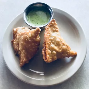 Vegetable samosa. Made this fresh and straight out of the fryer. The green sauce was full of flavor!