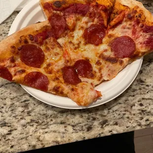 two slices of pepperoni pizza