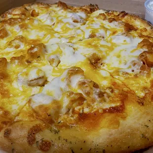 The Buff Chik specialty pizza. Medium heat, your choice of grilled or crispy chicken. Served with a side of ranch.