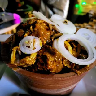 a bowl of food with onions