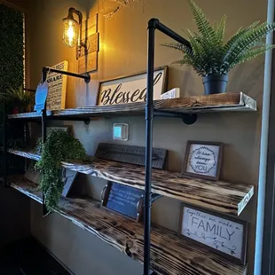 shelves with plants and signs