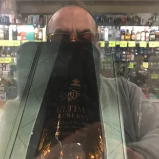 a man holding a bottle