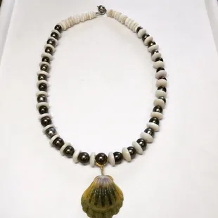Necklace With tahitian Pearl puka Shells and mounrise Shells