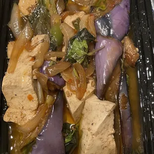 tofu and vegetables in a black container
