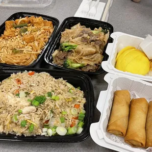Stop: Pad Thai with Tofu, Beef Drunken Noodle, Mango and Sticky Rice. Bottom: Thai Fried Rice and spring rolls i think