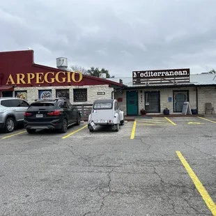 a parking lot with parked cars