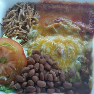 Combo plate with red and green enchiladas and a chile relleno to go. Delicious and very fresh.