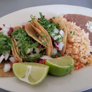 Tacos de Pastor with rice and beans. So good!!