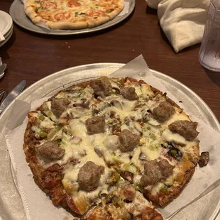 Small bruschetta pizza and small cauliflower crust house pizza.